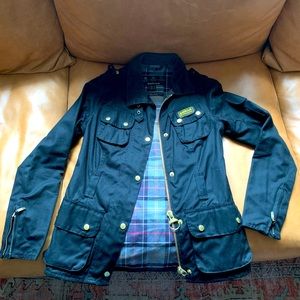 Women’s Barbour Canvas Jacket with tartan lining and corduroy collar.
